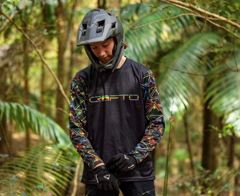 standing Bike rider in shirt and helmet